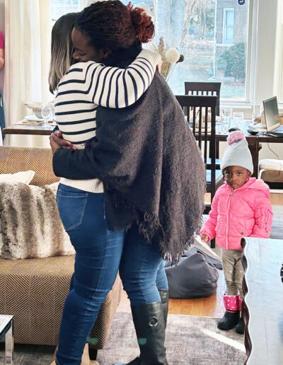 mentor hugging 2024 graduate at her new home