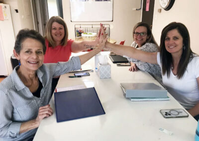 FHF women high-fiving
