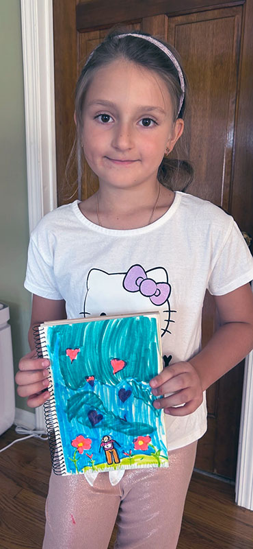 Happy kiddo with her self portrait