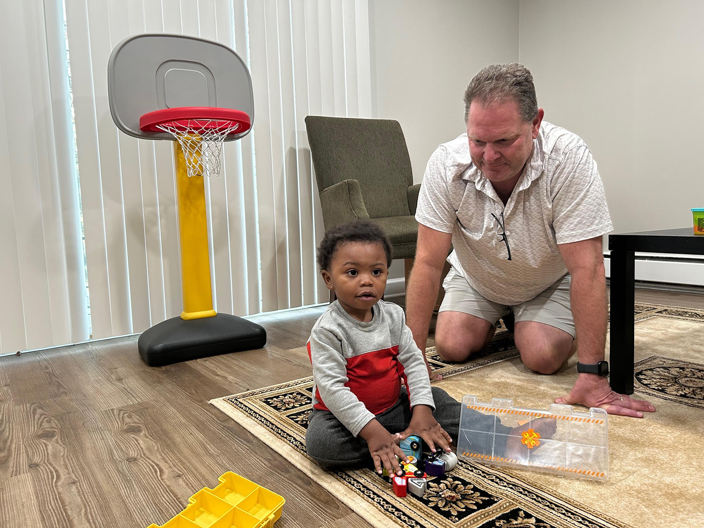FHF mentor playing trucks with child